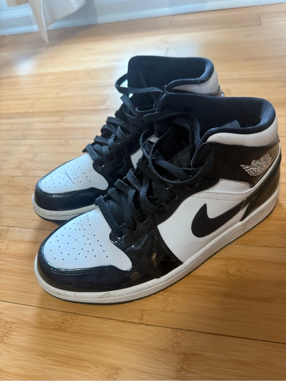 Jordan Black and White Mid-Top Sneakers